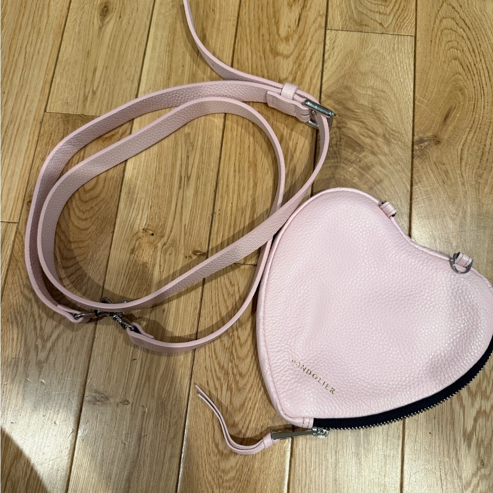 Bandolier. iPhone 12 Pro case with attachable heart bag and strap.